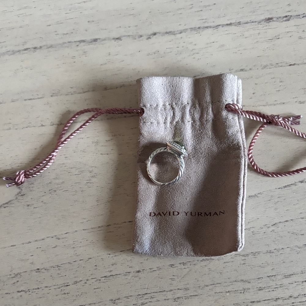 David Yurman Silver Ring with Tan Pouch
Size 61/2 peridot stone and diamonds